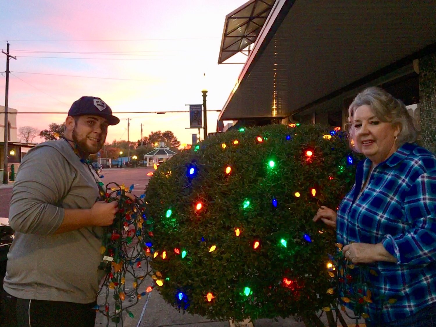 Main Street Board Members Nic Watkins and Pat Hamlett were among those who helped decorate downtown for Christmas.